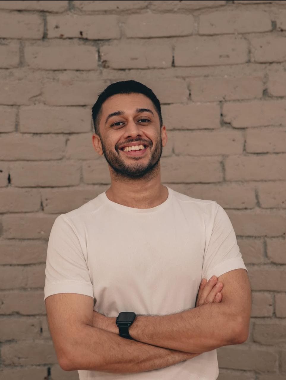 Portrait of Satvik smiling with folded arms